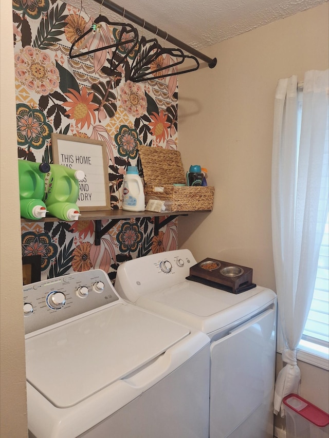 13631 Tolan Rd, Ossineke, MI 49766 - laundry room featuring washing machine and clothes dryer and a textured ceiling