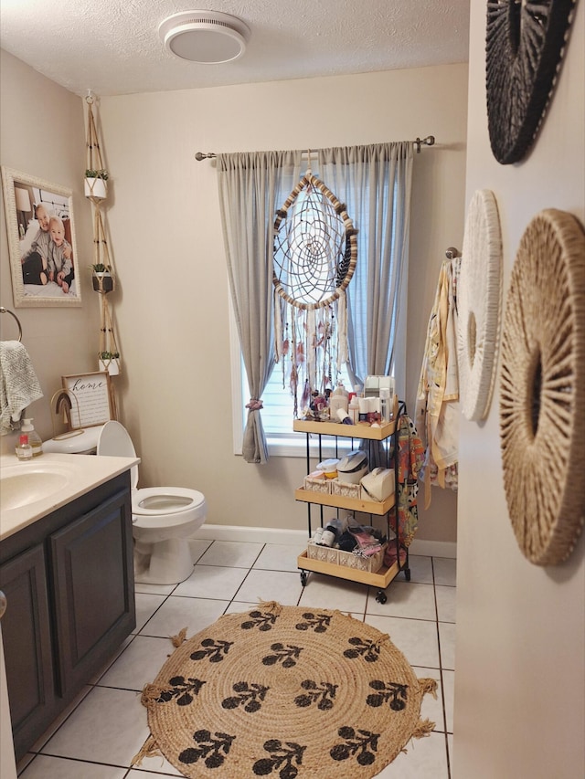 13631 Tolan Rd, Ossineke, MI 49766 - bathroom with vanity, tile patterned flooring, and a textured ceiling