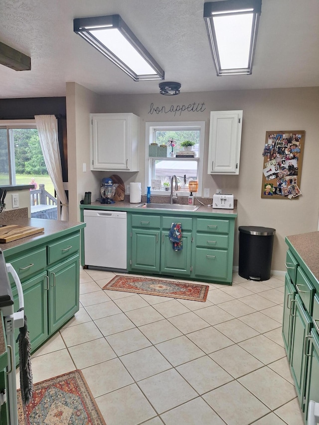 13631 Tolan Rd, Ossineke, MI 49766 - kitchen with green cabinets, white cabinetry, white dishwasher, healthy amount of natural light, and a textured ceiling