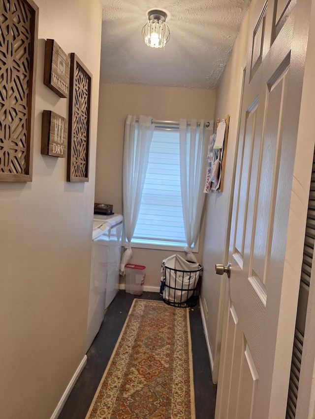 13631 Tolan Rd, Ossineke, MI 49766 - laundry room featuring washing machine and dryer and a textured ceiling