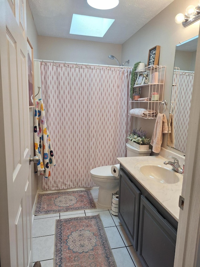 13631 Tolan Rd, Ossineke, MI 49766 - full bathroom featuring a skylight, vanity, tile patterned flooring, and a shower with shower curtain