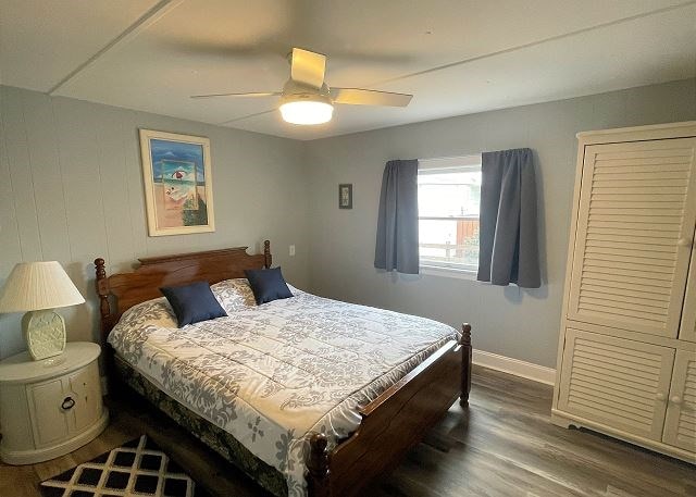 bedroom featuring wood-type flooring and ceiling fan