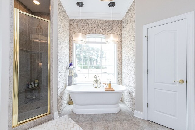 bathroom with tile patterned flooring, crown molding, and independent shower and bath