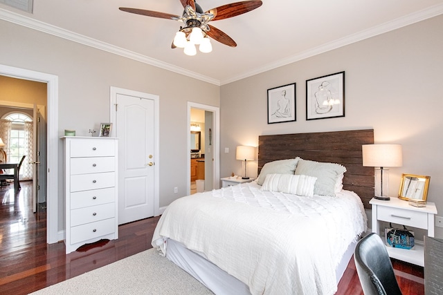 bedroom with ensuite bathroom, crown molding, ceiling fan, and dark wood-type flooring