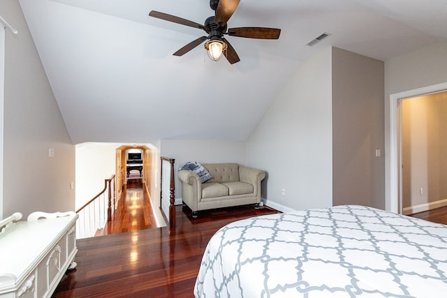 bedroom featuring ceiling fan, dark hardwood / wood-style floors, and vaulted ceiling