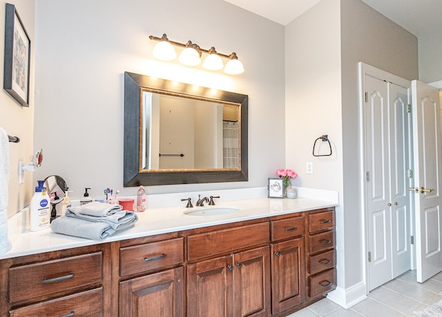 bathroom featuring tile patterned floors and vanity