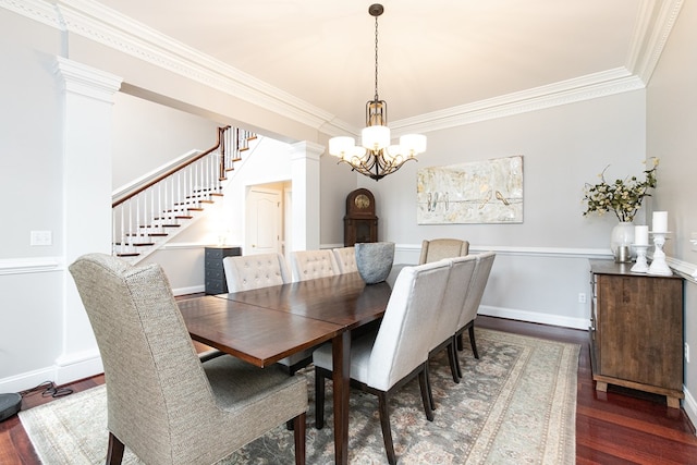 dining room featuring dark hardwood / wood-style flooring, a notable chandelier, and ornamental molding