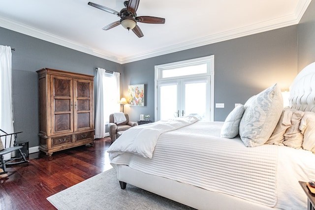 bedroom with ceiling fan, ornamental molding, dark wood-type flooring, and multiple windows