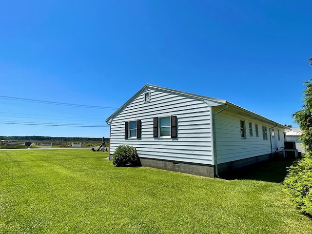 7669 E Side Rd, Chincoteague, VA 23336 - view of side of property featuring a lawn and crawl space