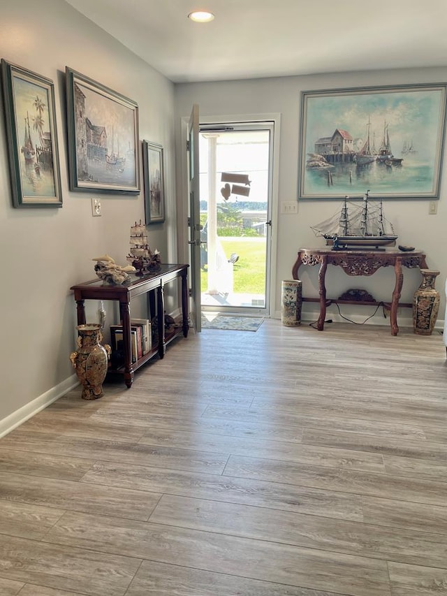 7669 E Side Rd, Chincoteague, VA 23336 - entrance foyer with wood finished floors, recessed lighting, and baseboards