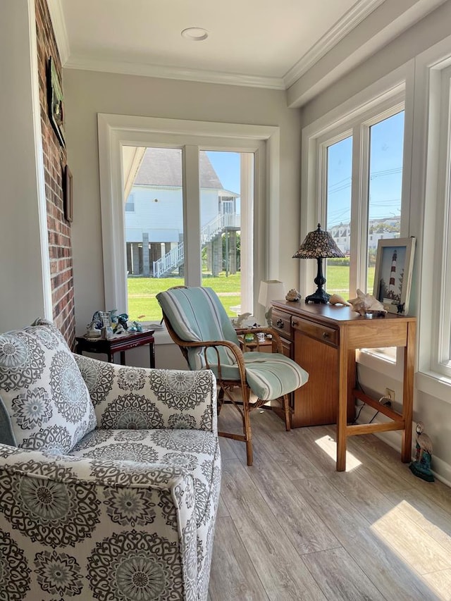 7669 E Side Rd, Chincoteague, VA 23336 - living area with light wood-type flooring and crown molding