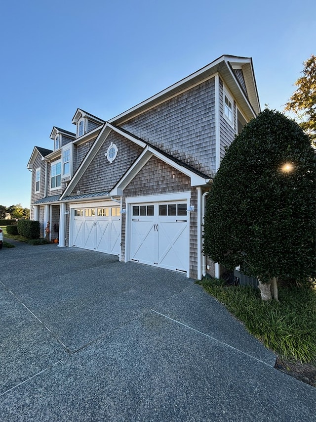 view of side of property featuring a garage