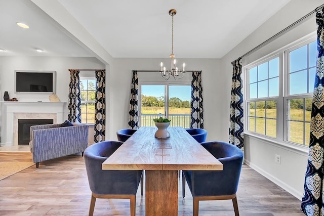 LOT476 Driftwood Dr, Greenbackville, VA 23356 - dining space featuring a chandelier, wood finished floors, a fireplace, baseboards, and recessed lighting