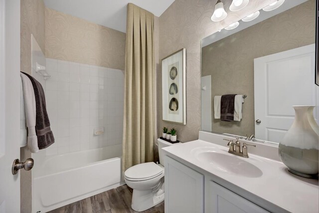 LOT476 Driftwood Dr, Greenbackville, VA 23356 - full bathroom featuring wallpapered walls, wood finished floors, toilet, vanity, and shower / bathtub combination with curtain
