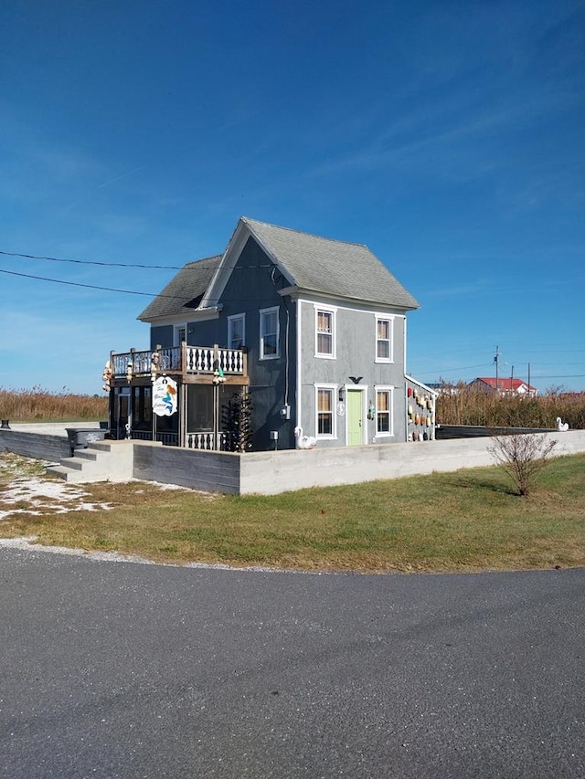 view of side of property with a yard