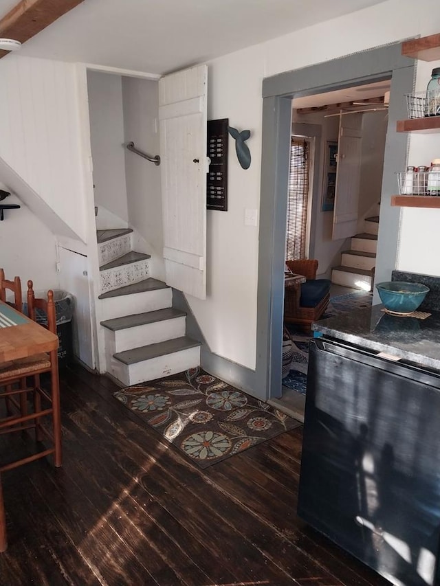 staircase featuring hardwood / wood-style flooring