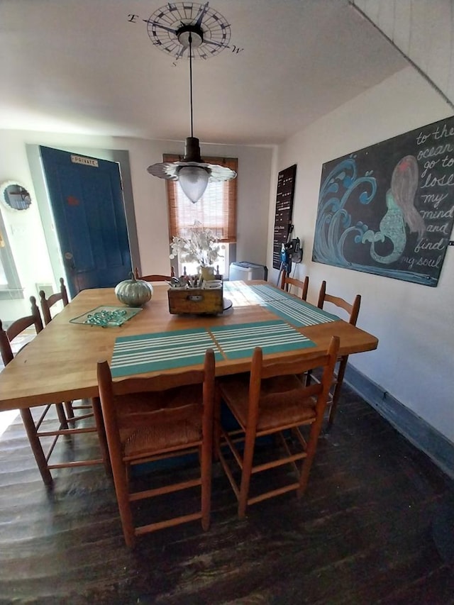 dining room with dark hardwood / wood-style floors