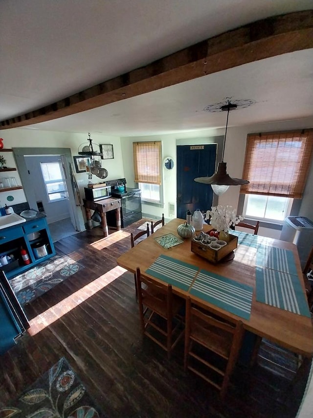 dining space featuring dark hardwood / wood-style flooring