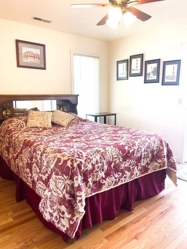 bedroom featuring ceiling fan and wood-type flooring