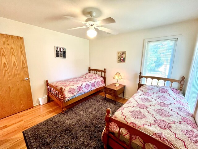 bedroom featuring wood-type flooring and ceiling fan