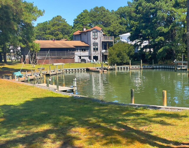 property view of water with a dock