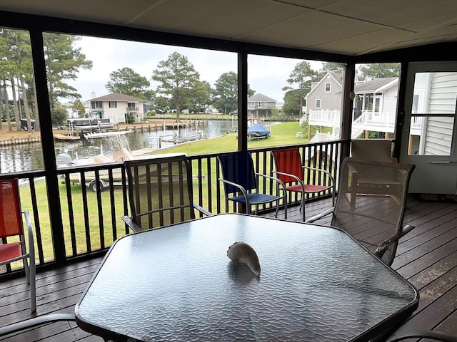 deck featuring a yard and a water view