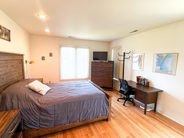 bedroom with light wood-type flooring