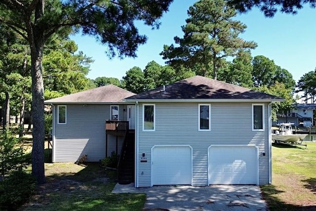 back of property with a garage