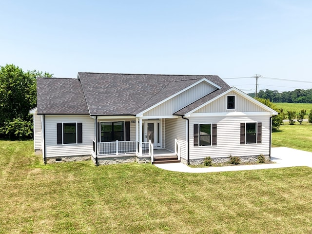 27192 Castle Row, Cape Charles, VA 23310 - view of front of property with covered porch, roof with shingles, and a front lawn