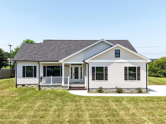 27192 Castle Row, Cape Charles, VA 23310 - view of front facade featuring a porch, a shingled roof, and board and batten siding