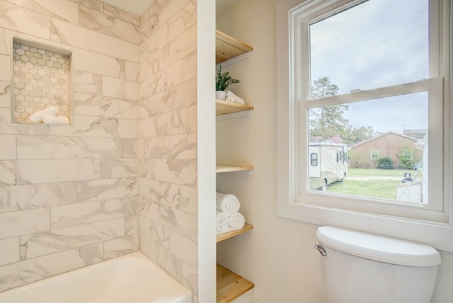 bathroom with toilet and plenty of natural light