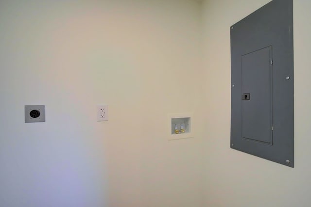 clothes washing area featuring hookup for an electric dryer, laundry area, electric panel, and washer hookup