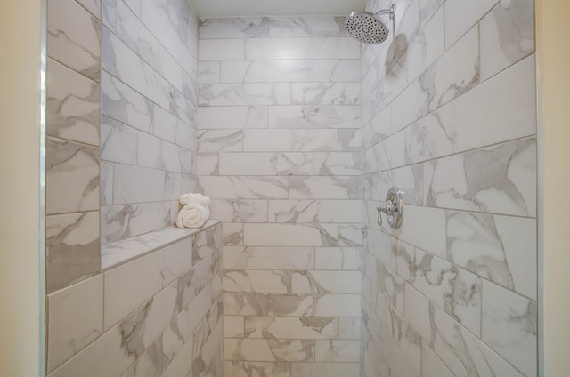 interior space featuring a tile shower