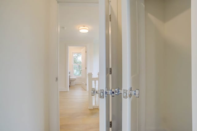 corridor with light wood finished floors
