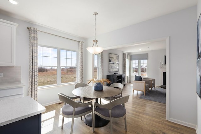 dining space featuring light hardwood / wood-style flooring