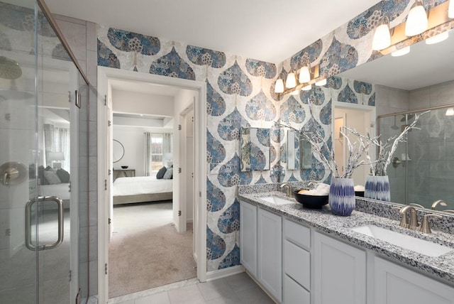 547 Skipper Ct, Greenbackville, VA 23356 - full bathroom with connected bathroom, double vanity, a shower stall, wallpapered walls, and tile patterned flooring