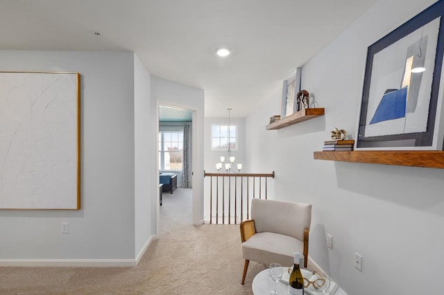547 Skipper Ct, Greenbackville, VA 23356 - hallway with carpet floors and a chandelier