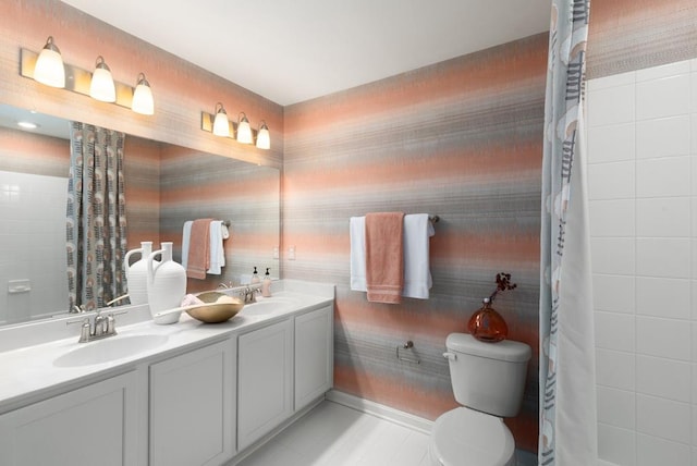 bathroom featuring tile patterned floors, vanity, and toilet