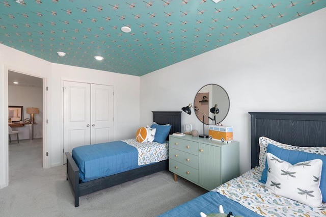 bedroom featuring a closet and carpet