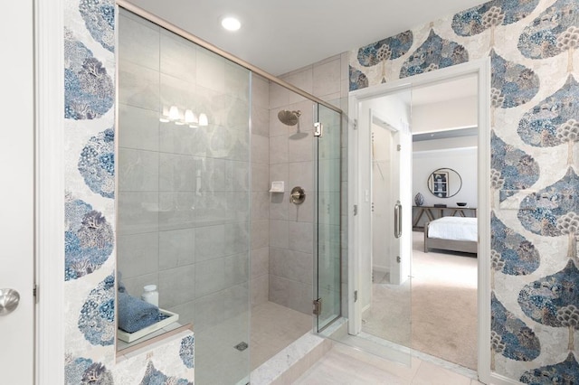 bathroom with tile patterned floors and an enclosed shower