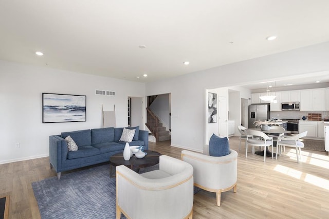 living room with light hardwood / wood-style floors