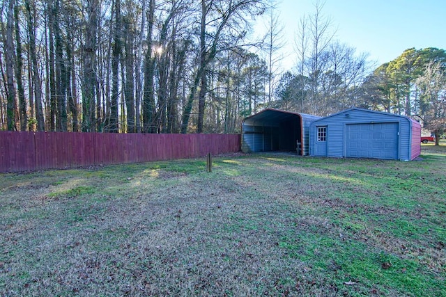 view of yard featuring an outbuilding and a carport