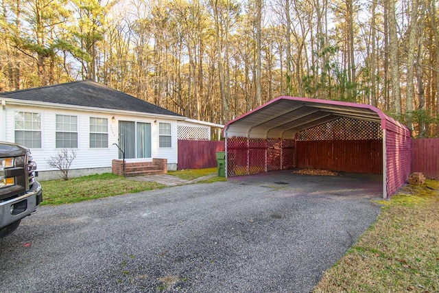 view of front facade with a carport