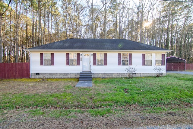 view of front facade with a front yard and a carport