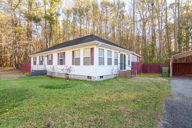 view of front of house featuring a front yard and a carport