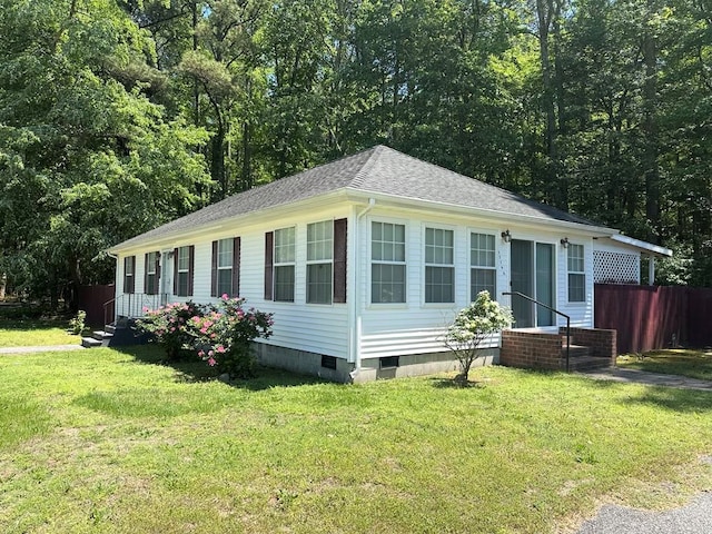 12196 Tower Way, Exmore, VA 23350 - view of side of property with fence, crawl space, a yard, entry steps, and a shingled roof