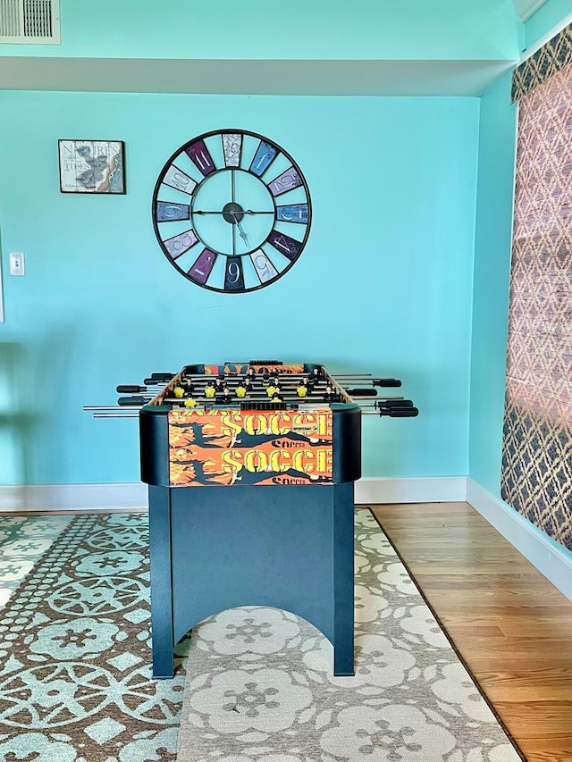 3250 Colona St, Chincoteague, VA 23336 - game room featuring baseboards, wood finished floors, and wallpapered walls