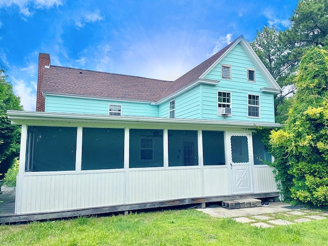 3250 Colona St, Chincoteague, VA 23336 - rear view of property with a sunroom, a chimney, and a shingled roof