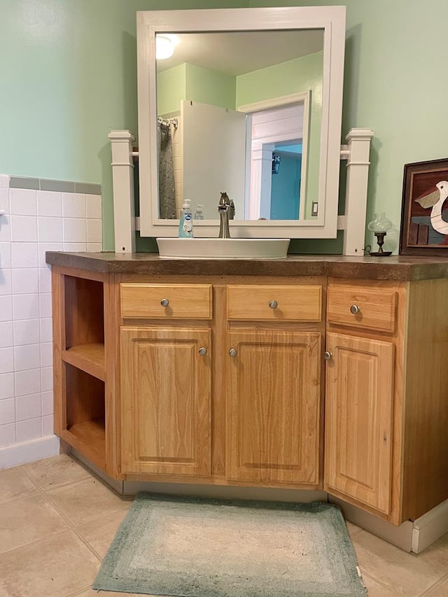 3250 Colona St, Chincoteague, VA 23336 - bathroom featuring vanity and tile walls