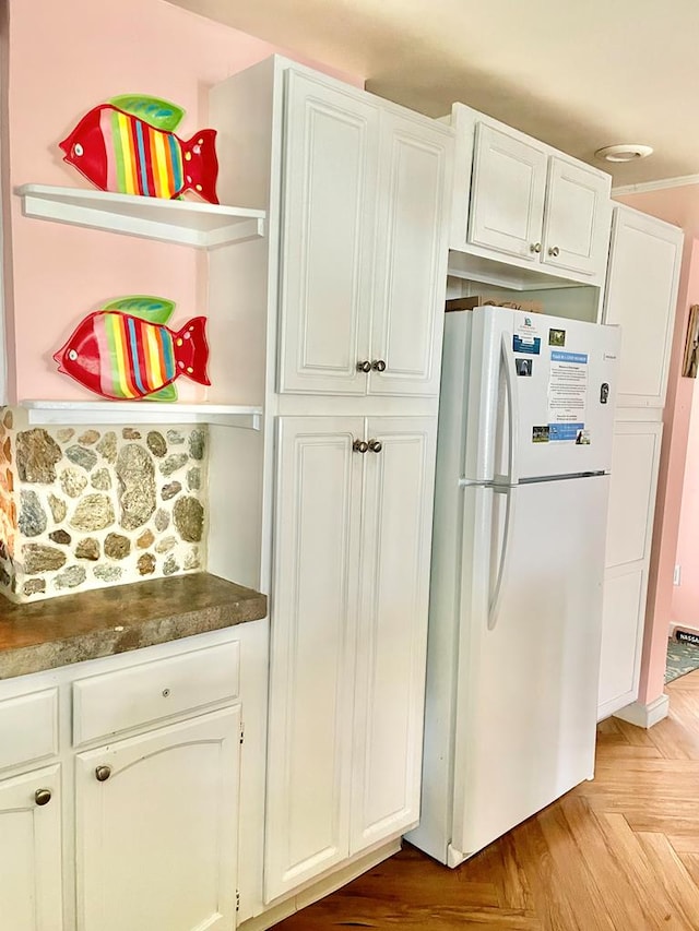 3250 Colona St, Chincoteague, VA 23336 - kitchen with freestanding refrigerator, open shelves, white cabinetry, and dark countertops